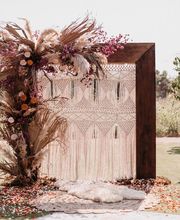 Wedding arch made of wood and flowers